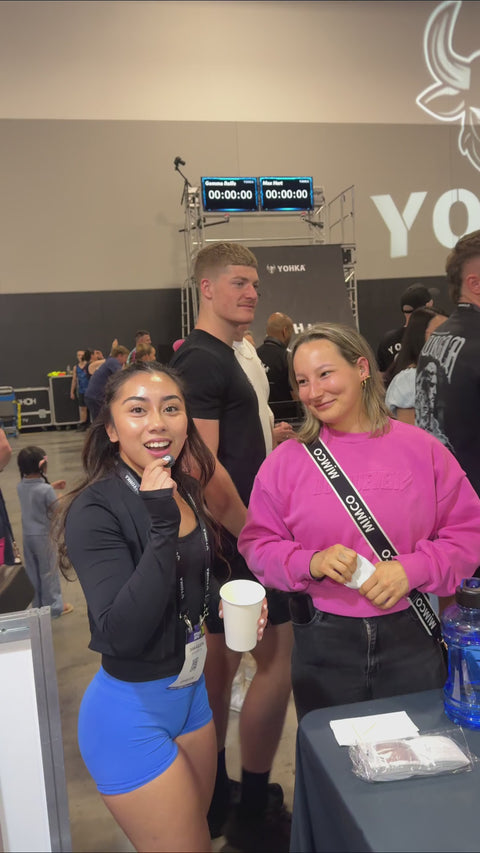 Woman taste-testing protein coffee for energy and recovery